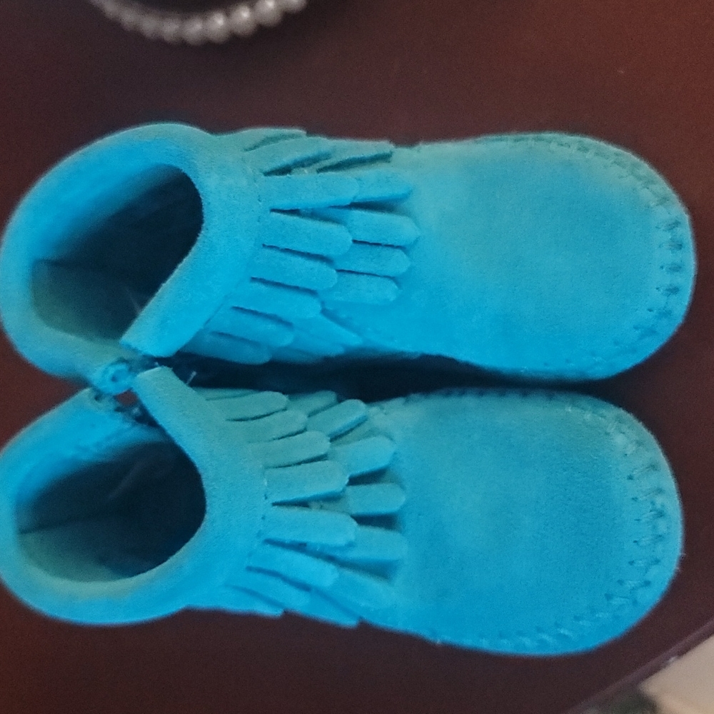 Teal minnetonka moccasins size 2 never worn